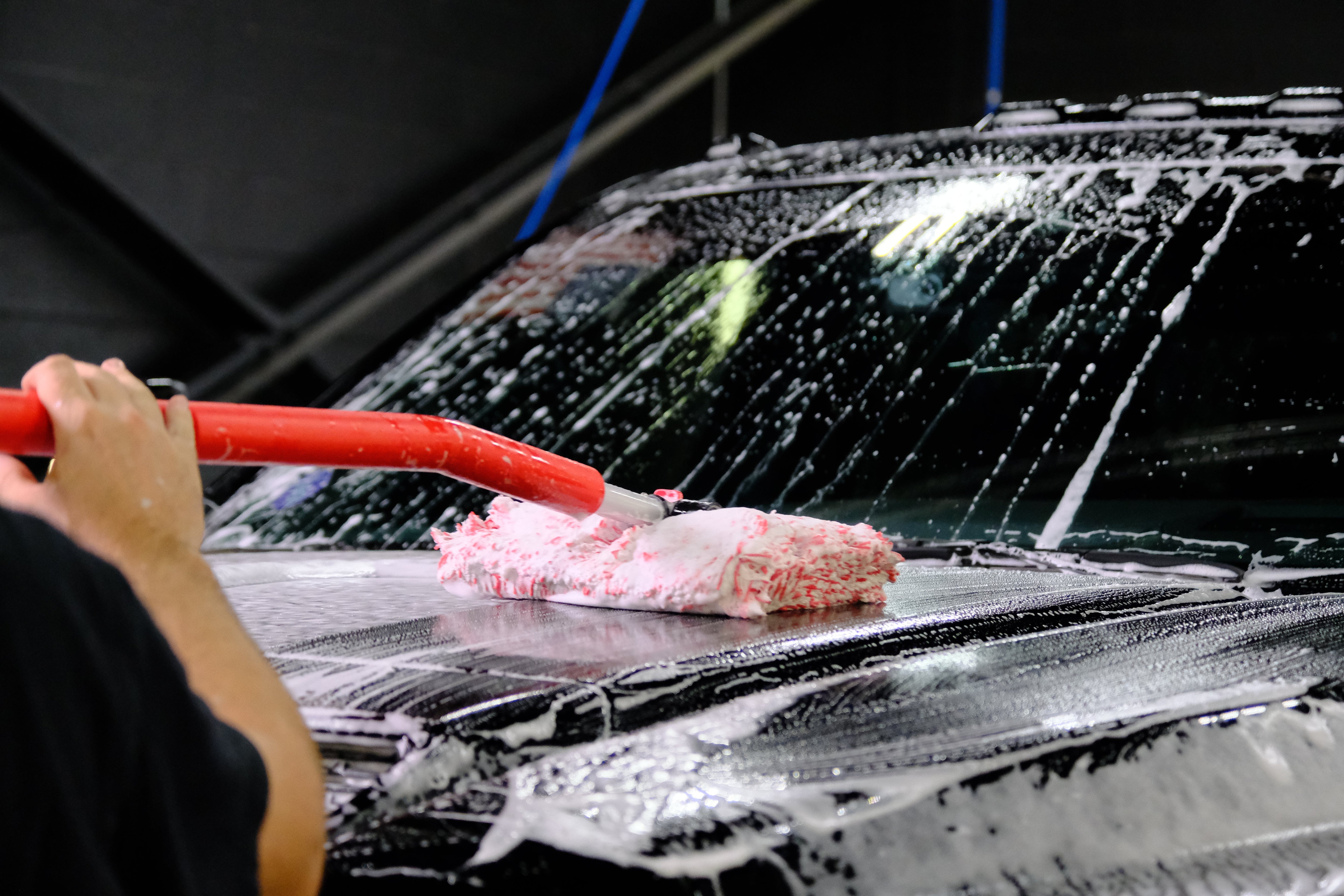 Red Mitt on a Stick Pro+ on hood of truck.