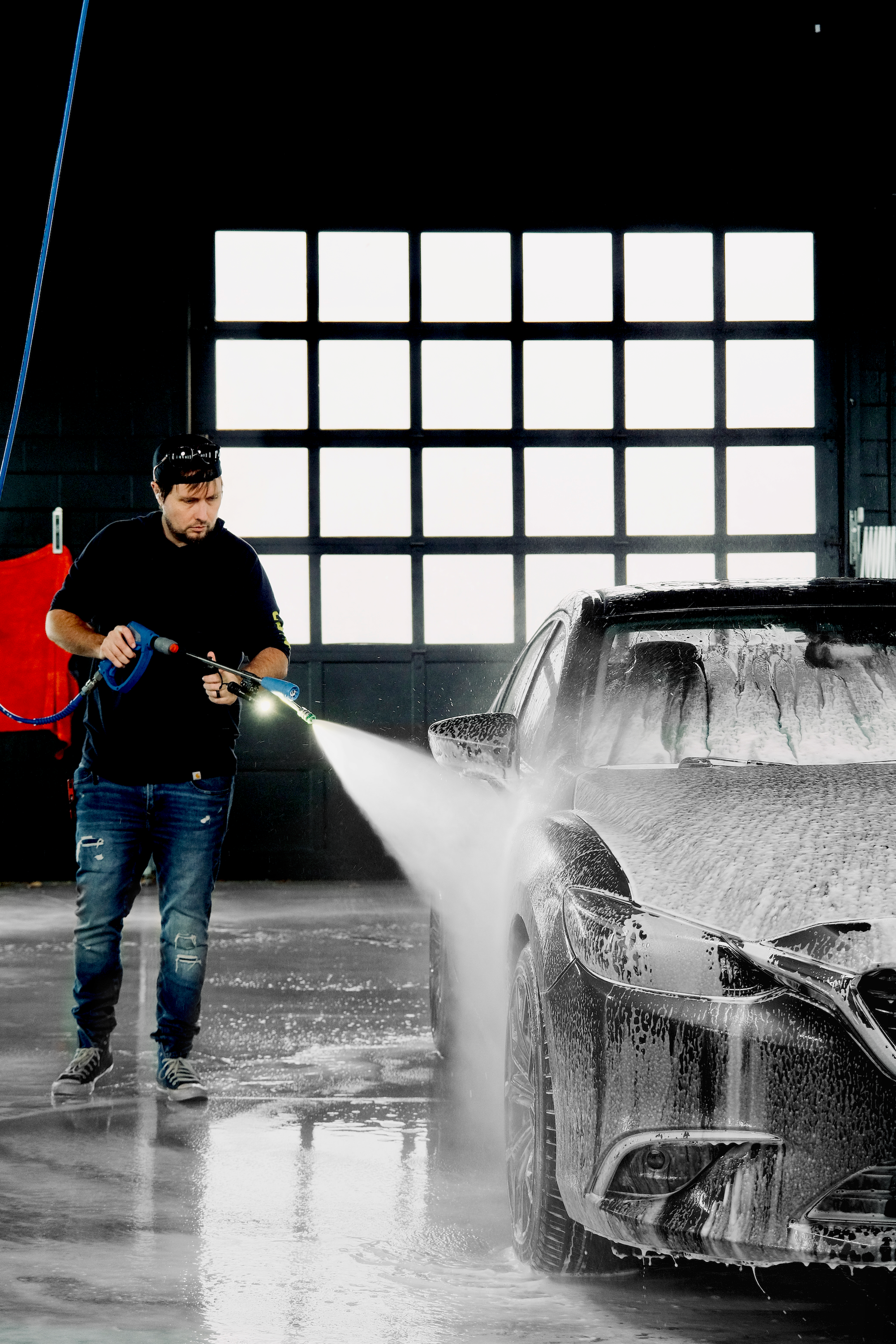 Bob pressure washing vehicle in wash bay