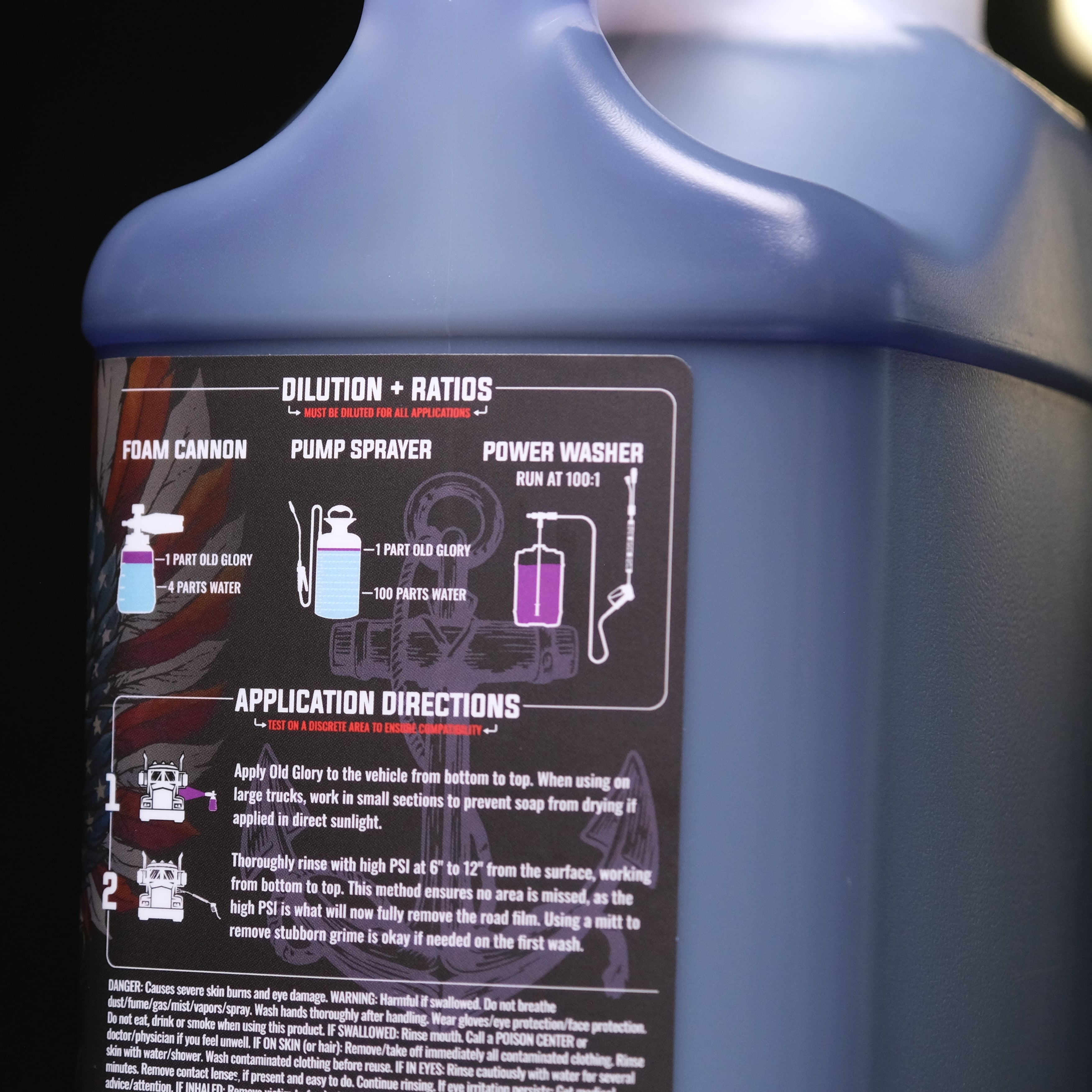 A close-up of a plastic gallon container of Old Glory Touch-Free Active Foam vehicle wash, showing the back label with instructions, dilution ratios, and application directions.