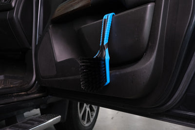 SKORP wheel brush hanging inside car door