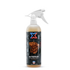 On a white background, a 16 oz bottle of orange interior cleaner and detailer called Interior with a graphic of a cowboy skull smoking a cigar on the label.