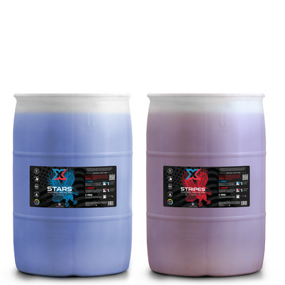 Two 55 gallon blue and red barrels filled with a touch-free two step vehicle wash with labels on a white background.