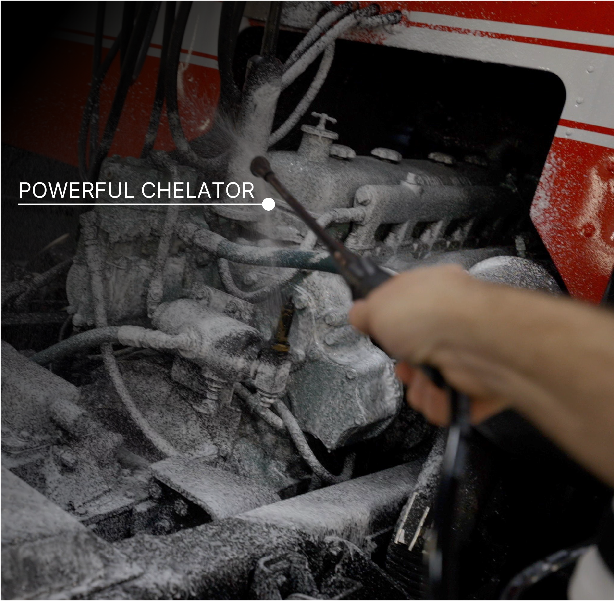 A close-up action shot of a person spraying a chemical solution onto a covered engine. The text 'POWERFUL CHELATOR' is overlaid on the left side.